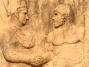 The handshake. Note that the king had himself made taller than the god.