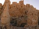 Below the headless seated figures sit the giant heads of Roman gods and the King himself.
